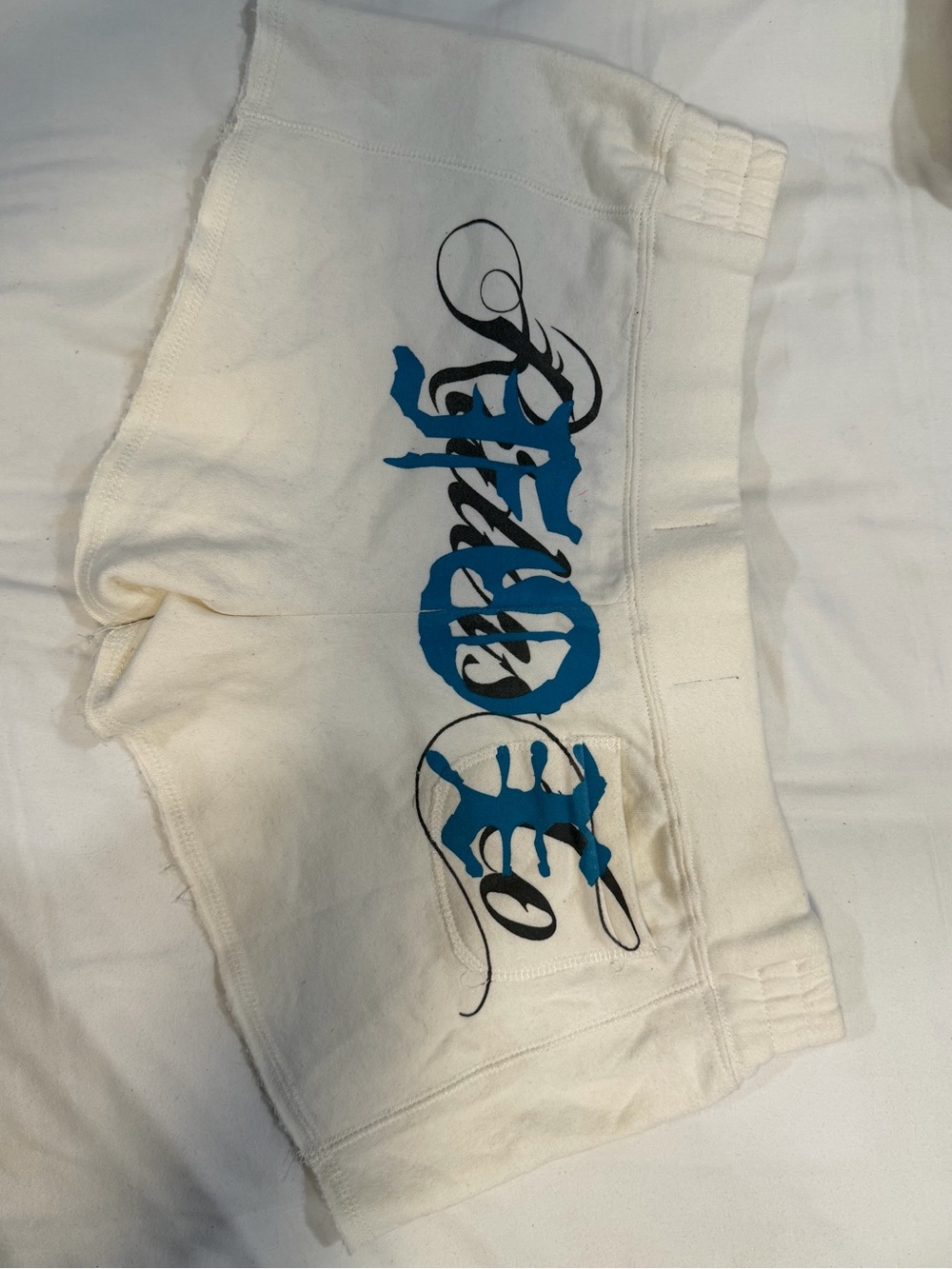 Fox White Shorts with Blue Script Graphic
